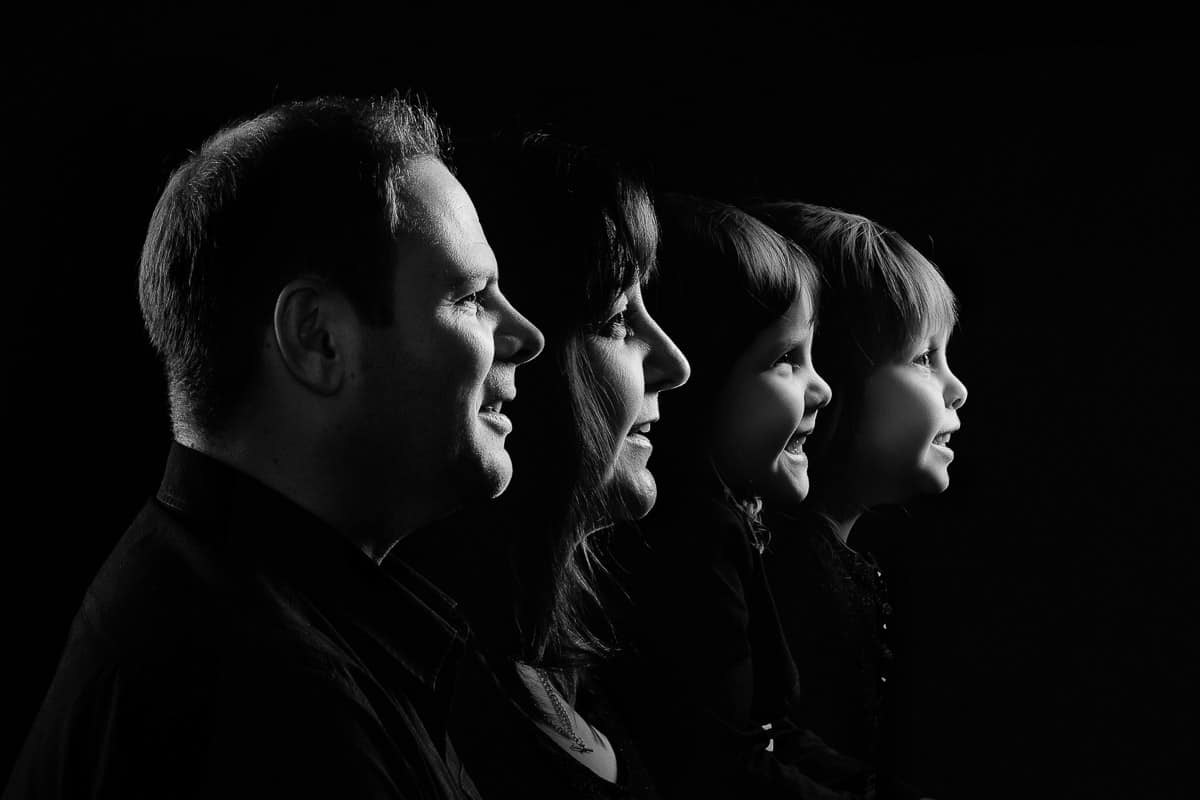 family portrait studio ideas - black and white profile of a family